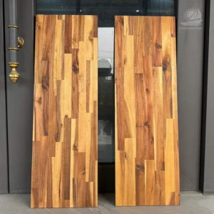 Custom size Acacia edge glued panels standing together.