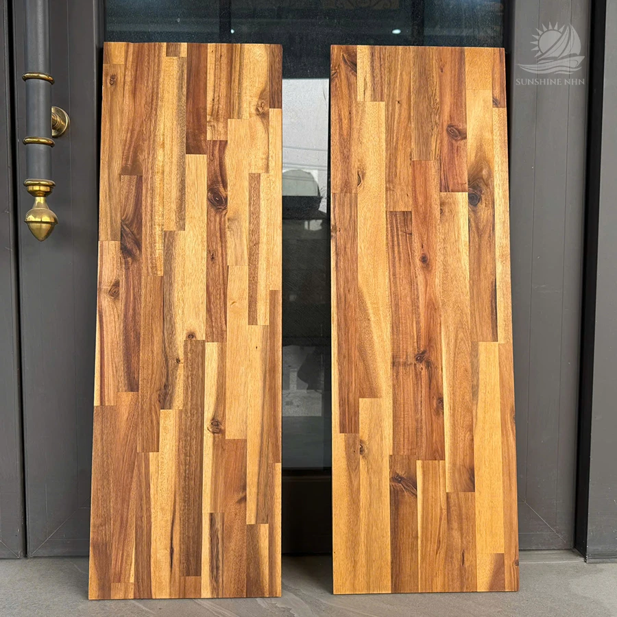 Custom size Acacia edge glued panels standing together.